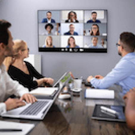People in Conference Room on Video Call